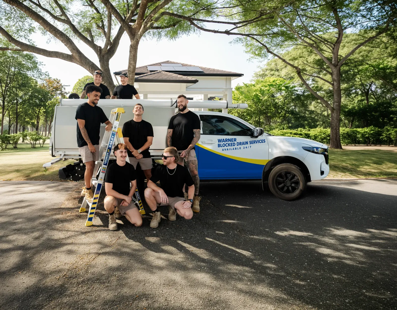 Warner Blocked Drain Services ute and team